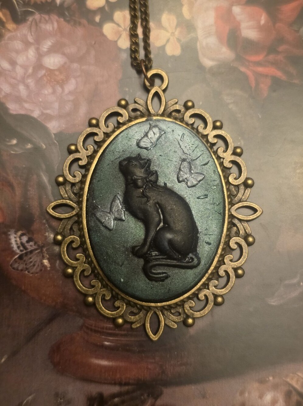Black Cat In A Metallic Green Backgroun On A Bronze Tone Frame & Chain Necklace